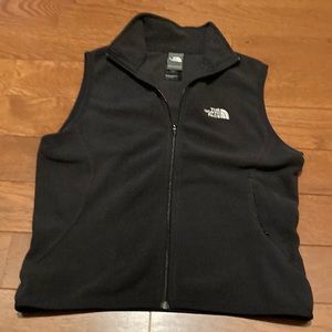 Black north face vests.  Lightly worn